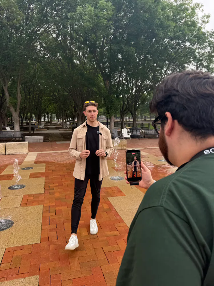 Maverick Digital team member recording social media video content outdoors
