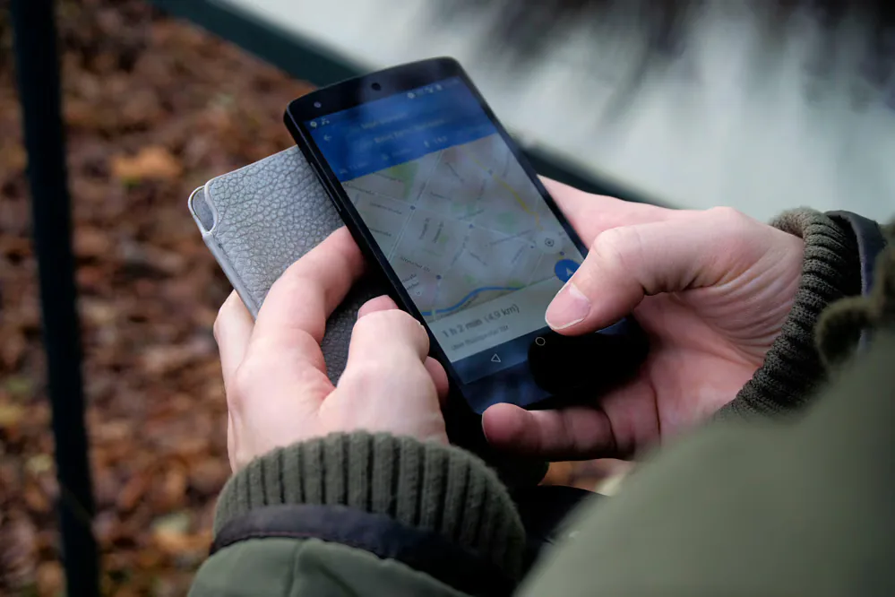 Person using a map app on a smartphone