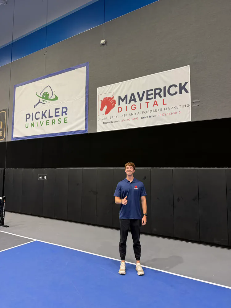 Maverick Digital banner beside Pickler Universe signage at a partner venue in Carrollton